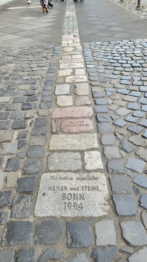 the engraved sidewalk stones, a tribute to the lives lost to AIDS